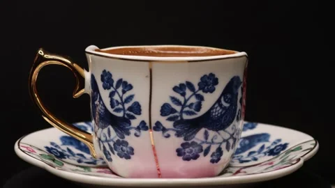 Plenty of sparkling coffee in a 360 degree rotating design cup Stock Footage 248564892