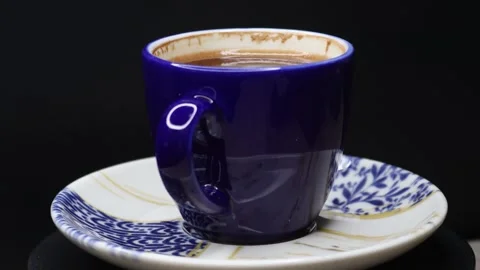 Plenty of sparkling coffee in a 360 degree rotating design cup Stock Footage 248565000