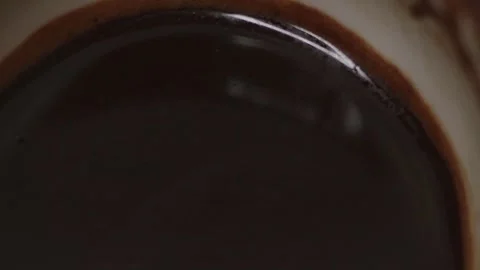 Plenty of sparkling coffee in a 360 degree rotating design cup Stock Footage 248565828