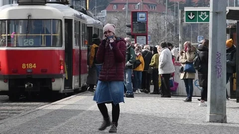 Pleople with mask gathering and walking at Hradcanska tram and train station in  Stock Footage 150884535