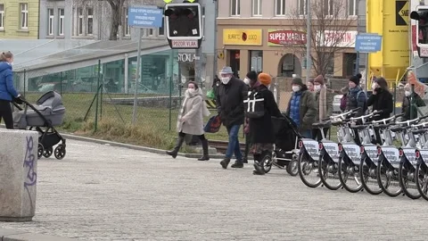 Pleople with mask gathering and walking at Hradcanska tram and train station  Stock Footage 151128611