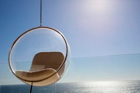 Plexiglas hanging chair Foto stock