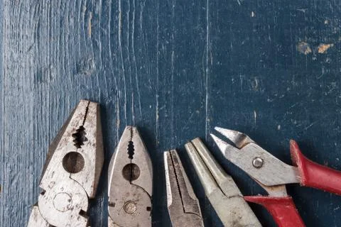 Pliers on blue table Stock Photos