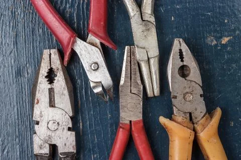 Pliers on blue table Stock Photos