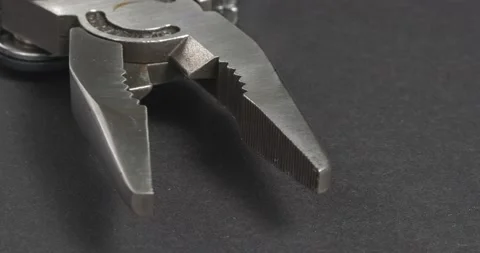 Pliers close-up on a dark background. Repair tools. Stockbeeldmateriaal 164282553