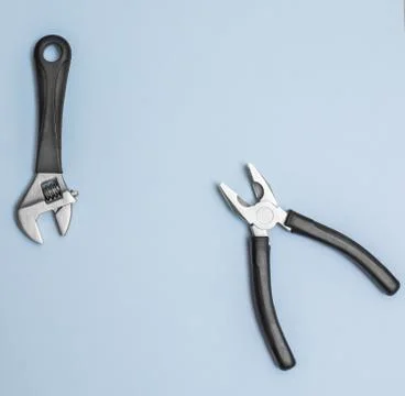 Pliers on flat lay: blue creative background for custom diy message. Stock-Fotos