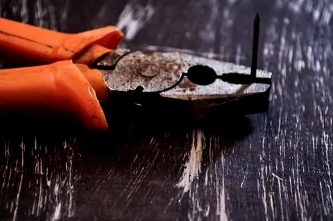Pliers for repair work lying on the table. Repair tools in the h Stock Photos