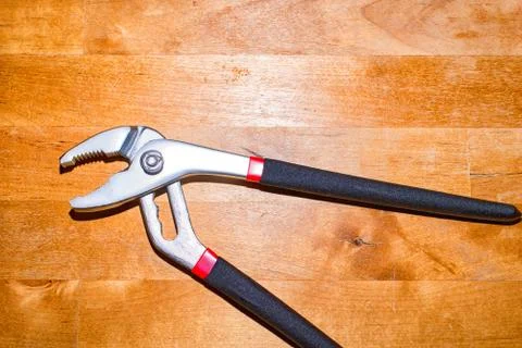 Pliers on the working surface Stock Photos