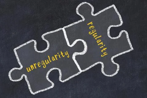 Ploblem solving. Chalk sketch of two puzzles with words unregularity and regu Stock Photos