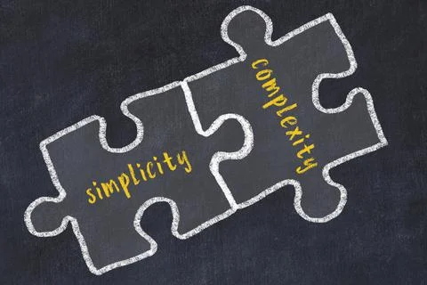 Ploblem solving. Chalk sketch of two puzzles with words simplicity and comple Stock Photos