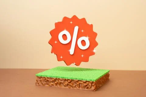 A plot of land and a discount percentage sticker. Promotional sale of land .. Stock Photos