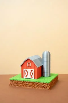A plot of land and a farm barn. Farming, agribusiness. Concept of rural land  Stock Photos