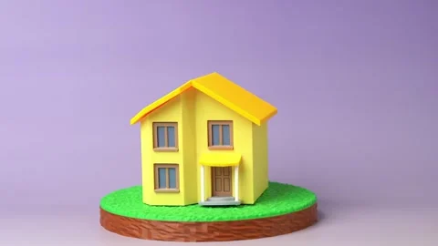 A plot of land and a residential house, figurines. Buying or building a home. Stock Footage 346817205