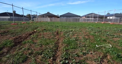 A plot of land designated for construction development in Tarneit, Australia Stock Footage 277268666