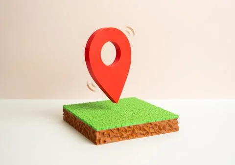A plot of land with a red geolocation symbol shows precise positioning. Map.. Stock Photos