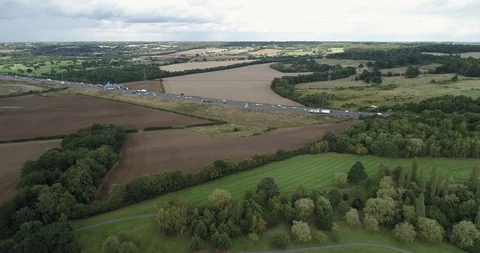 Plot of land situated next to golf course and main motorway road drone aerial 4k Stock Footage 125752633