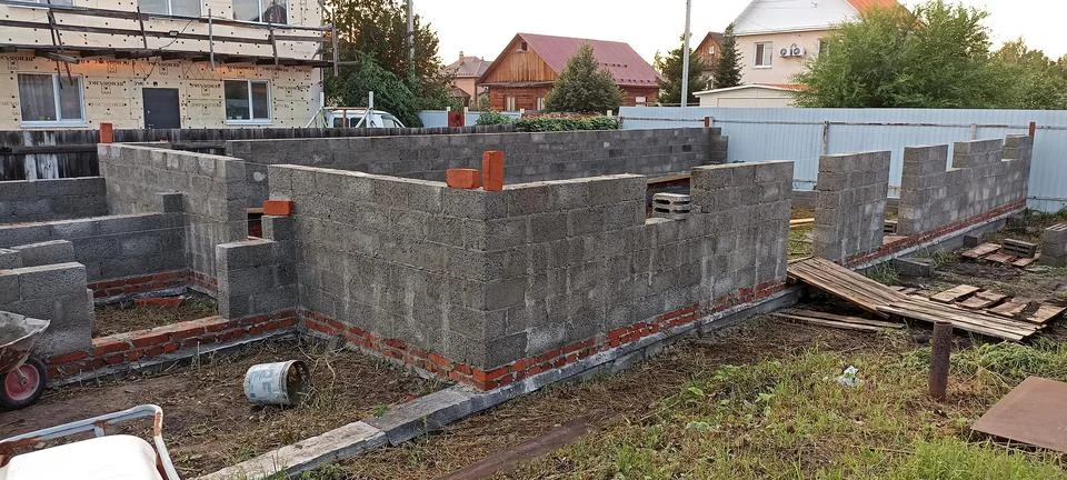 A plot of land on which construction of a foundation has begun Stock Photos