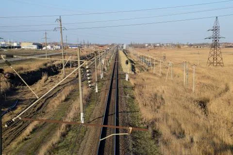 Plot railway. Top view on the rails. High-voltage power lines for electric tr Stock Photos