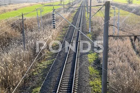 Plot railway. Top view on the rails. High-voltage power lines for ...