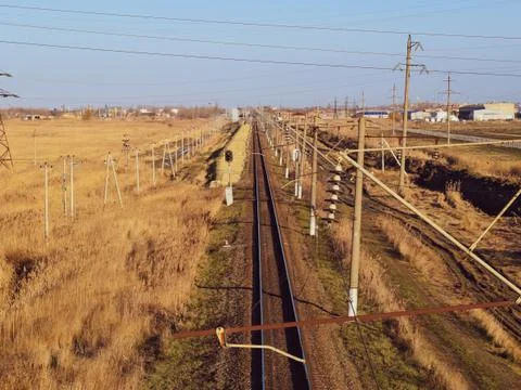Plot railway. Top view on the rails. High-voltage power lines for electric tr Stock Photos