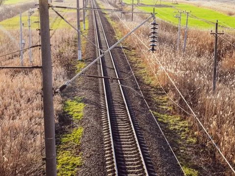 Plot railway. Top view on the rails. High-voltage power lines for electric tr Stock-Fotos