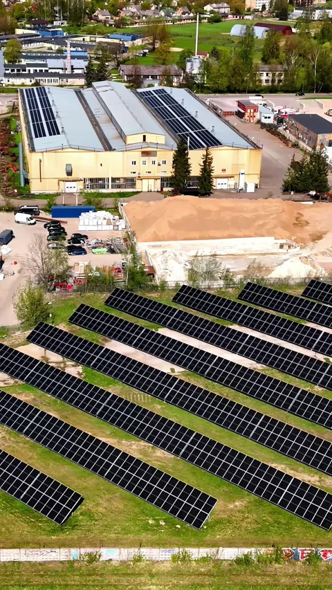 Plot with solar panels in an industrial park. Vertical aerial view 動画素材 313647187