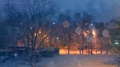 Plotagraph - winter weather on the yard outside, falling snow Stock Footage 100794236