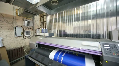 Plotter in printing house prints blue image on a large paper Stock Footage 35236678