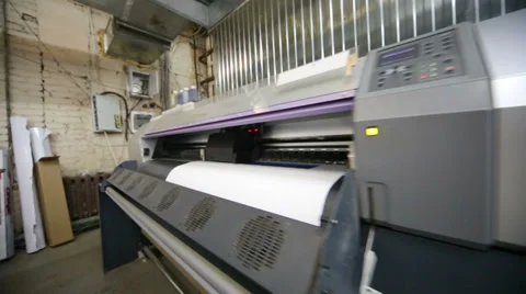 Plotter in printing house prints image on a large paper Stock Footage 35236650