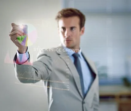 Plotting his business development. a businessman using a digital interface. Stock Photos