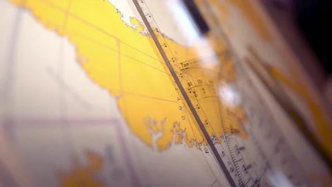Plotting position on navigational chart at sea. Marine Map and ruler Stock Footage 136235355