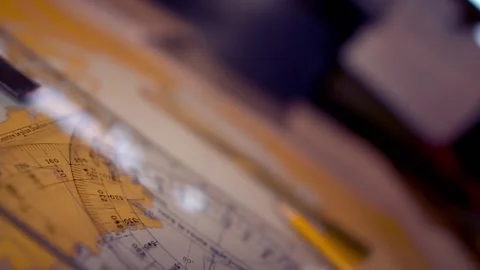 Plotting position on navigational chart at sea. Marine Map and ruler Stock Footage 136235409