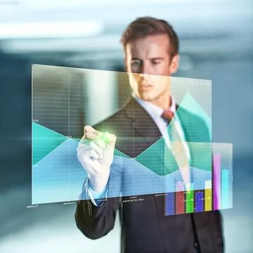 Plotting projections with just a touch. a handsome young businessman drawing a Stock Photos