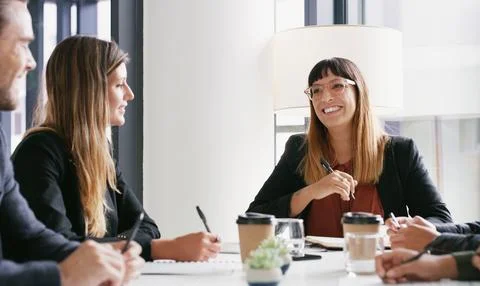 Plotting their way to many great profits. a group of businesspeople having a Fotos de archivo