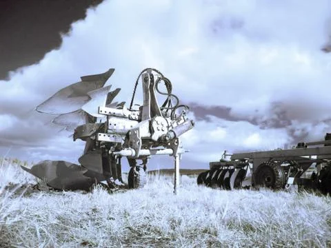 Plough machines  on fields 스톡 사진