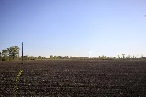 Ploughed field at sunset Stock Photos