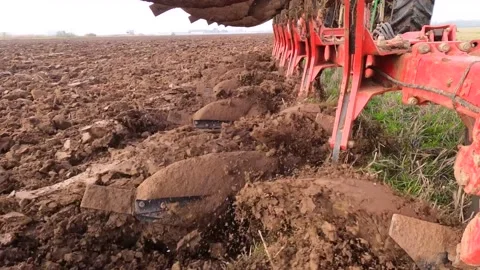 Ploughing Wheat Stubble UK Stock Footage 142808855