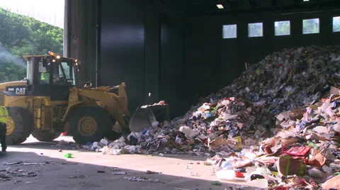 Plow pushing heap of trash (1 of 10) Stock-Footage 32283703
