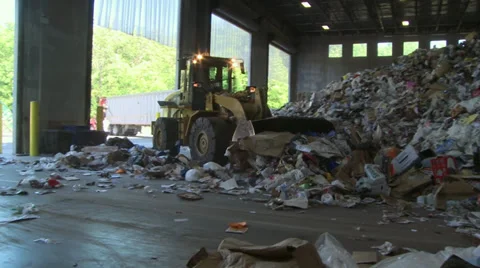 Plow pushing heap of trash (5 of 10) Stock-Footage 32283661