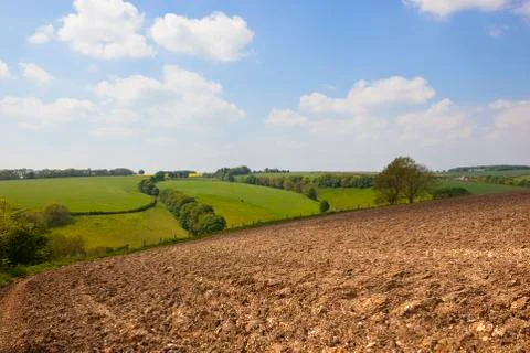 Plow soil and patchwork fields Stock Photos