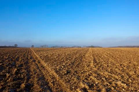 Plow soil in winter Stock Photos