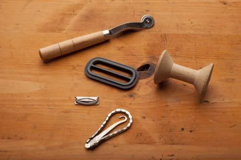 Plow, spool and tailor tools craft concept on wooden texture Stock Photos
