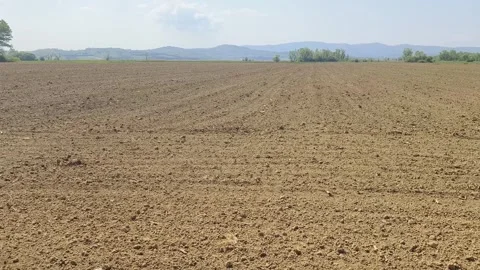 Plowed agricultural field in springtime Stock Footage 272475006
