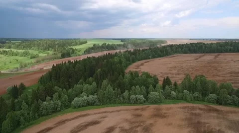 Plowed fields, forests and thundercloud aerial view 스톡 동영상 66250591