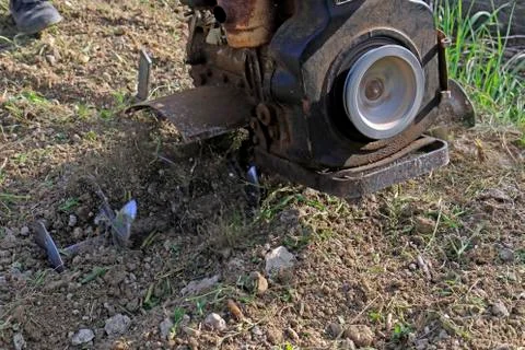 Plowing the earth Stock Photos