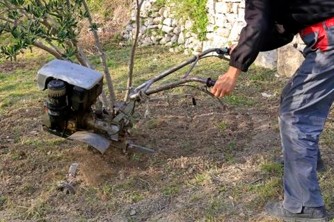 Plowing the earth Stock Photos