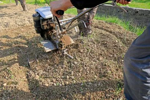 Plowing the earth Stock Photos