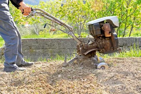 Plowing the earth Stock Photos
