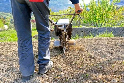 Plowing the earth Stock Photos