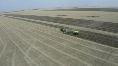 Plowing endless farmland Stock Footage 240646228